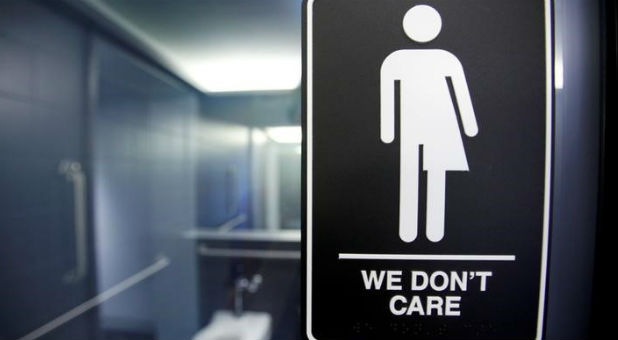 A sign protesting a recent North Carolina law restricting transgender bathroom access