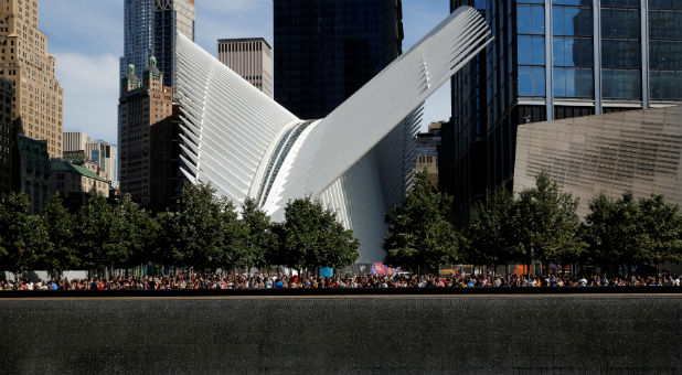 People gather at the National September 11 Memorial and Museum on the 15th anniversary of the 9/11 attacks in Manhattan, New York, September 11, 2016.