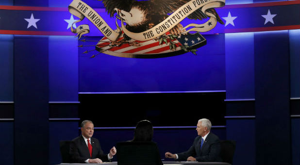 Republican U.S. vice presidential nominee Governor Mike Pence (R) speaks as Democratic U.S. vice presidential nominee Senator Tim Kaine listens and moderator Elaine Quijano (C) looks on during their vice presidential debate at Longwood University in Farmville, Virginia, U.S., October 4, 2016.