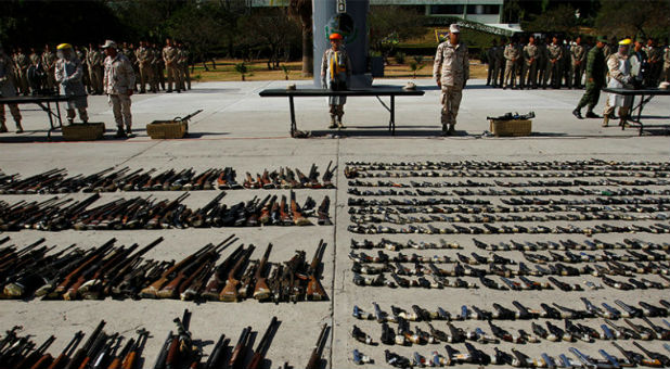 Weapons seized from criminal gangs are displayed before being destroyed by military personnel at a military base in Tijuana, Mexico
