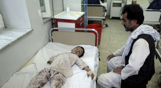 An Afghan boy receives treatment at a hospital after a bomb blast in northern Mazar-i-Sharif, Afghanistan.
