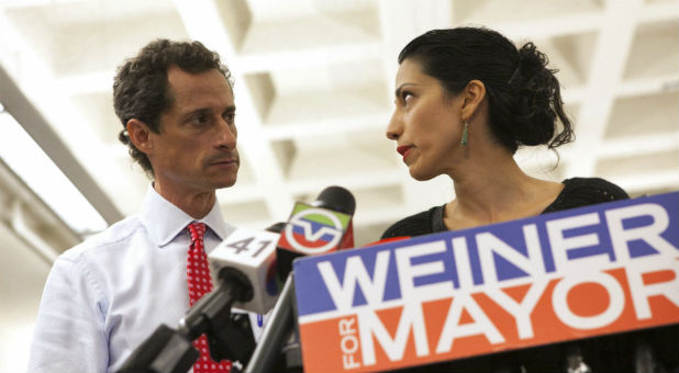New York mayoral candidate Anthony Weiner and his wife, Huma Abedin, attend a news conference in New York on July 23, 2013.