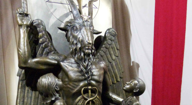A bronze statue of Baphomet—a goat-headed winged deity that has been associated with satanism and the occult—is displayed by the Satanic Temple.