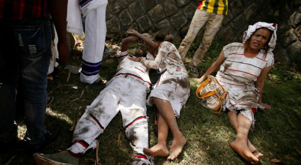 Injured protesters wait for help after several people died during the Irrechaa, the thanks giving festival of the Oromo people in Bishoftu town of Oromia region.