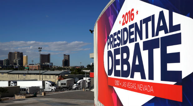 A banner hangs at the University of Las Vegas site of the last 2016 U.S. presidential debate within sight of hotels on the strip in Las Vegas