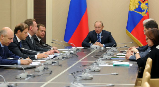 Russian President Vladimir Putin chairs a meeting with government members