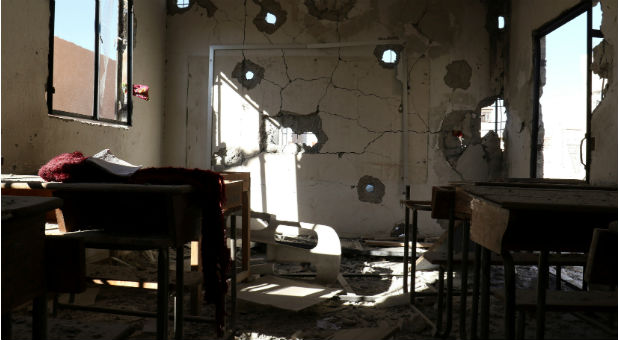 A damaged classroom is pictured after shelling in the rebel held town of Hass, south of Idlib province, Syria
