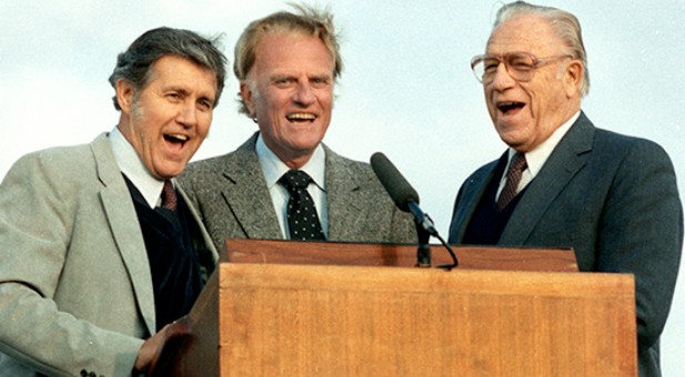 (Left to right) Cliff Barrows, Billy Graham and George Beverly Shea singing
