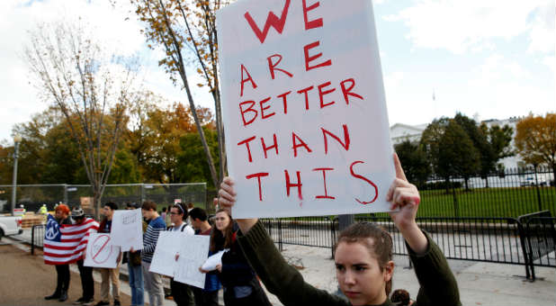 Demonstrators protest against the election of U.S. president-elect Donald Trump in front of the White House in Washington.