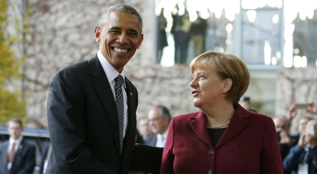 U.S. President Barack Obama is welcomed by German Chancellor Angela Merkel upon his arrival at the chancellery in Berlin, Germany