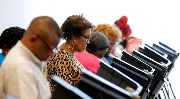 Voters cast their ballots during early voting at the Beatties Ford Library in Charlotte, North Carolina