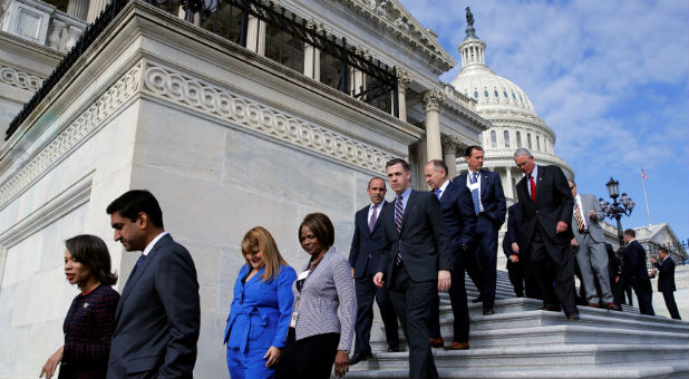 Newly-elected freshman U.S. House members depart the steps of the U.S. Capitol after holding a class photo in Washington