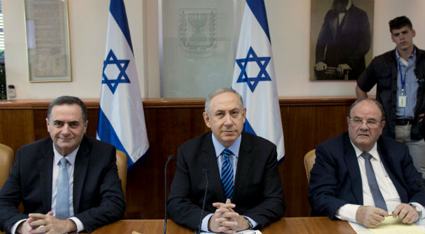 Israeli Prime Minister Benjamin Netanyahu (C) attends the weekly cabinet meeting at his office in Jerusalem.