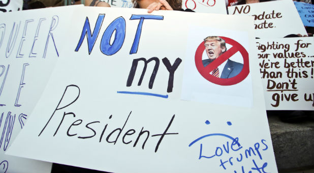 Protester Kim Lisenby demonstrates against the election of Republican Donald Trump as president of the United States.