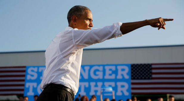 U.S. President Barack Obama departs after delivering remarks at a North Carolina Democratic Party