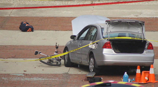 A car that police say was used by an attacker to plow into a group of students is seen outside Watts Hall on Ohio State University's campus in Columbus.