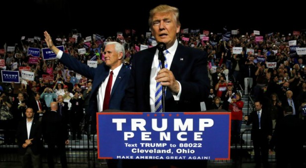 Republican U.S. presidential nominee Donald Trump (R) and vice presidential candidate Mike Pence (L) hold a campaign rally in Cleveland, Ohio, U.S., Oct. 22, 2016.