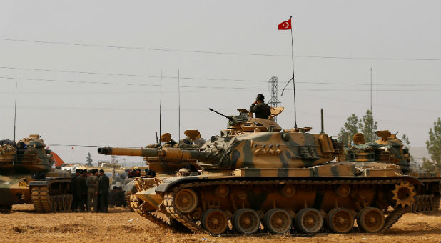 Turkish army tanks and military personnel are stationed in Karkamis on the Turkish-Syrian border in the southeastern Gaziantep province, Turke