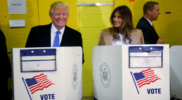 Republican nominee Donald Trump casts his vote with his wife Melania at his side.