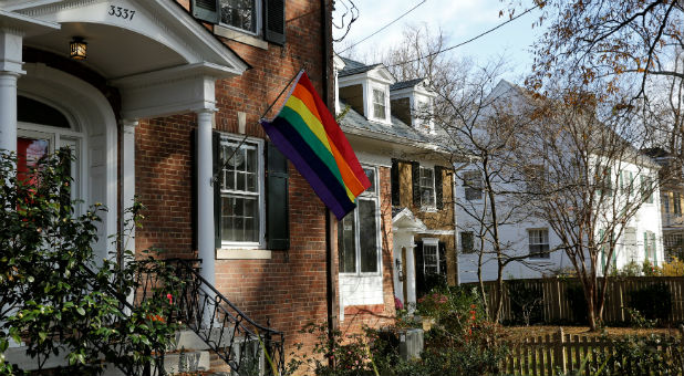A home flies the rainbow flag in solidarity with the LGBT community two doors down from U.S. Vice-President-elect Mike Pence's rental home