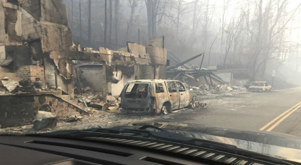 Burned buildings and cars, aftermath of wildfire is seen in this image released in social media by Tennessee Highway Patrol in Gatlinburg, Tennessee, U.S.