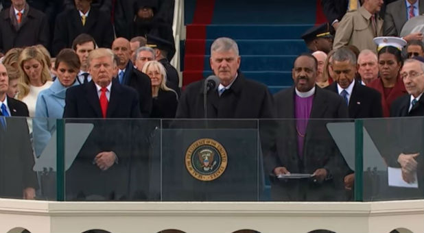 Evangelist Franklin Graham prays at the inauguration.
