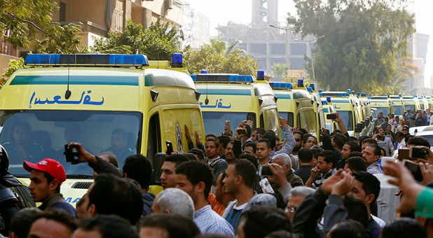Egyptian Christians shout as ambulances transport the bodies of victims killed in the bombing of Cairo's main Coptic cathedral to the funeral, in Cairo, Egypt, on Dec. 12, 2016.