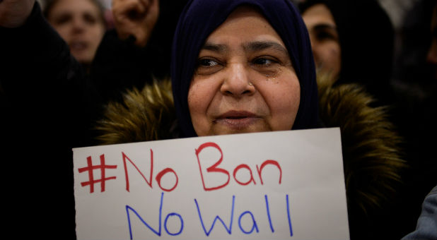 A Muslim women holds a sign during anti-Donald Trump travel ban protests outside Philadelphia International Airport in Philadelphia, Pennsylvania