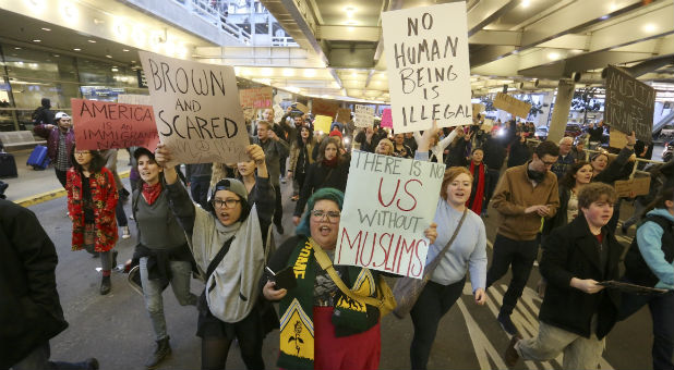 Activists gather at Portland International Airport to protest against President Donald Trump's executive action travel ban in Portland, Oregon