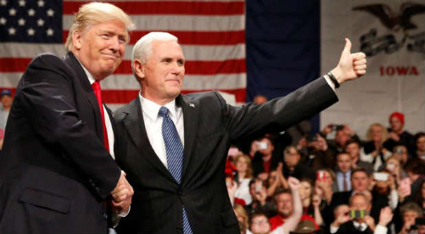 U.S. President-elect Donald Trump shakes hands with Vice President-elect Mike Pence at the USA Thank You Tour event at the Iowa Events Center in Des Moines, Iowa.