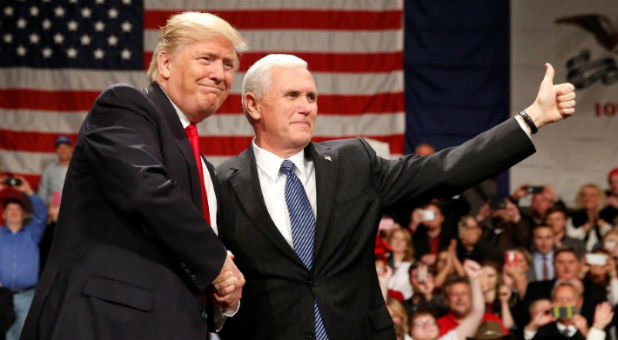 U.S. President-elect Donald Trump shakes hands with Vice President-elect Mike Pence at the USA Thank You Tour event at the Iowa Events Center in Des Moines, Iowa