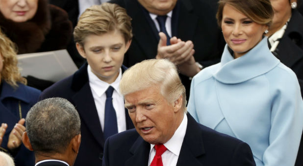 President-elect Donald Trump talks with outgoing President Barack Obama during inauguration ceremonies on the West front of the U.S. Capitol in Washington, U.S., January 20, 2017.