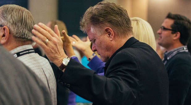 Pastor Jim Garlow in a file photo, shown praying.