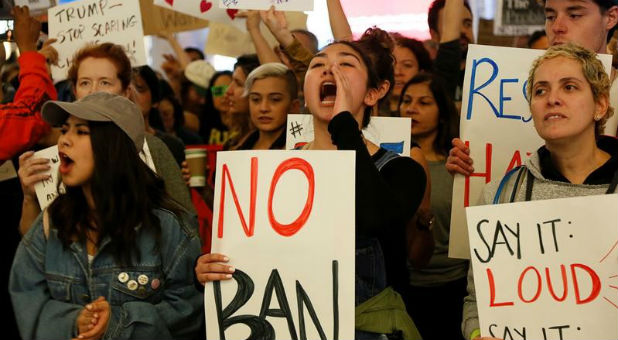 Demonstrators yell slogans during protest against the travel ban imposed by U.S. President Donald Trump's executive order, at Los Angeles International Airport in Los Angeles, California, Jan. 29, 2017.