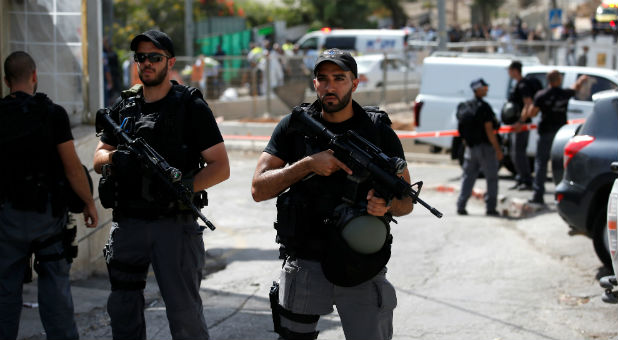 Israeli riot policemen secure the area following a shooting incident in what an Israeli police spokesperson described as a terrorist attack, in Sheikh Jarrah in East Jerusalem Oct. 9, 2016.