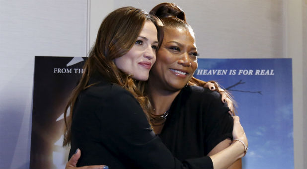 Cast members Jennifer Garner (L) and Queen Latifah pose at a photo call for the movie