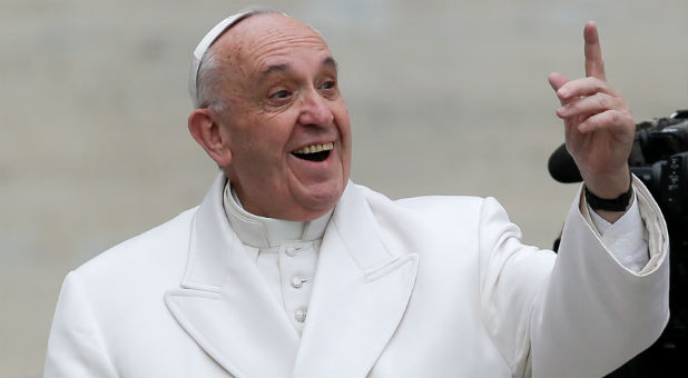 Pope Francis reacts as he leads the weekly general audience in Saint Peter's Square at the Vatican.