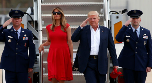 U.S. President Donald Trump and first lady Melania Trump step from Air Force One to attend a