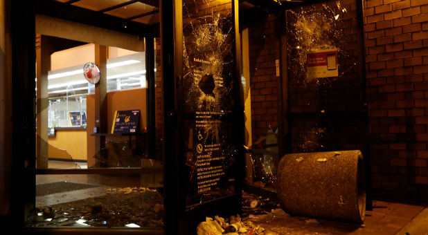 A vandalized Bank of America office is seen after a student protest turned violent at UC Berkeley during a demonstration over right-wing speaker Milo Yiannopoulos, who was forced to cancel his talk, in Berkeley, California