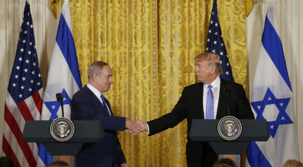 U.S. President Donald Trump (R) greets Israeli Prime Minister Benjamin Netanyahu after a joint news conference at the White House in Washington, D.C., Feb. 15, 2017.