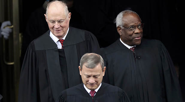 Chief Justice John Roberts and Associate Justices Clarence Thomas and Anthony Kennedy