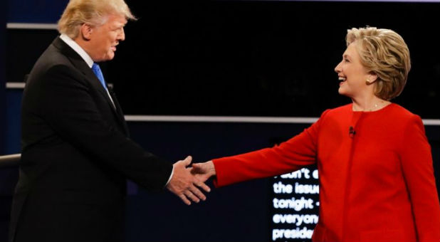 Donald Trump shakes hands with opponent Hillary Clinton.