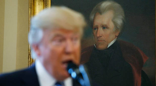 President Donald Trump with Andrew Jackson portrait in the Oval Office