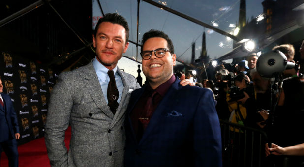 Cast members Luke Evans (L) and Josh Gad pose at the premiere of