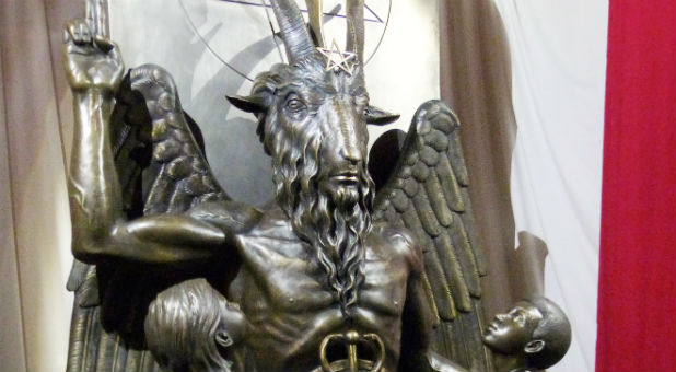 A one-ton, 7-foot (2.13-m) bronze statue of Baphomet --a goat-headed winged deity that has been associated with satanism and the occult --is displayed by the Satanic Temple