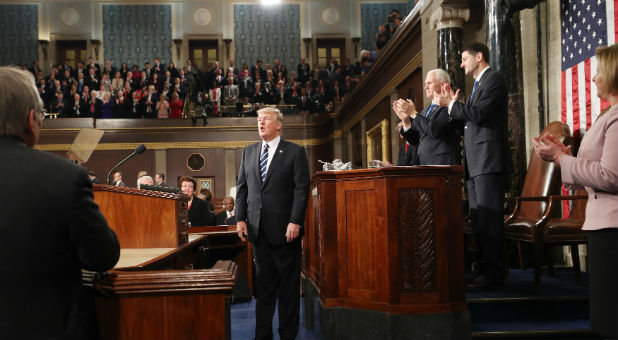 U.S. President Donald Trump is applauded after delivering his first address to a joint session of Congress from the floor of the House of Representatives in Washington.