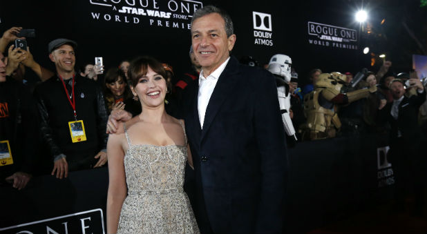 Actress Felicity Jones and Chief Executive Officer of Disney Bob Iger arrive at the world premiere of the film
