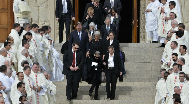 U.S. Supreme Court Justice Ruth Bader Ginsburg (C) departs the funeral mass for fellow Justice Antonin Scalia with Justice Samuel Alito (L-center) and other justices at the Basilica of the National Shrine of the Immaculate Conception in Washington