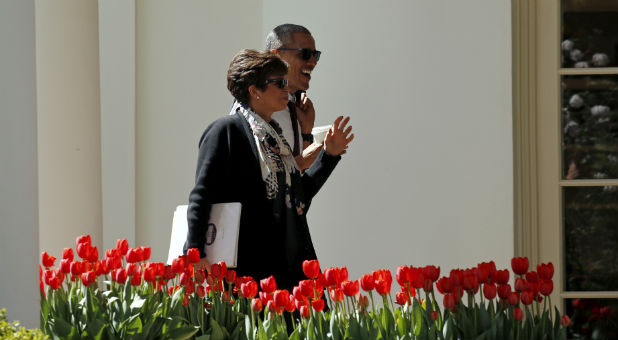 Barack Obama talks with his advisor Valerie Jarrett
