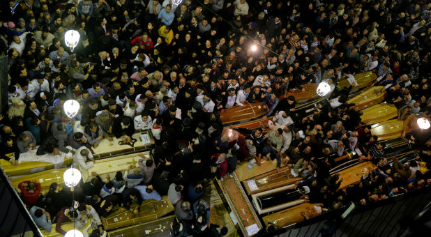 Coffins are seen inside the Coptic church that was bombed on Sunday, in Tanta, Egypt.